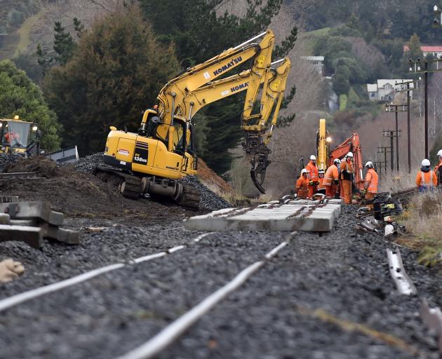 Workers upgrade the railway line near Factory Rd, Mosgiel, yesterday. Photo: Peter McIntosh.