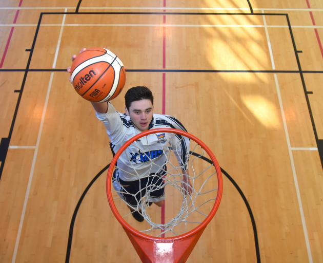 Taiaroa Porima-Flavell slams downs a basket at the Otago Boys' High School gym yesterday. The 17-year-old has just been named in the New Zealand under-18 team. Photo: Gregor Richardson