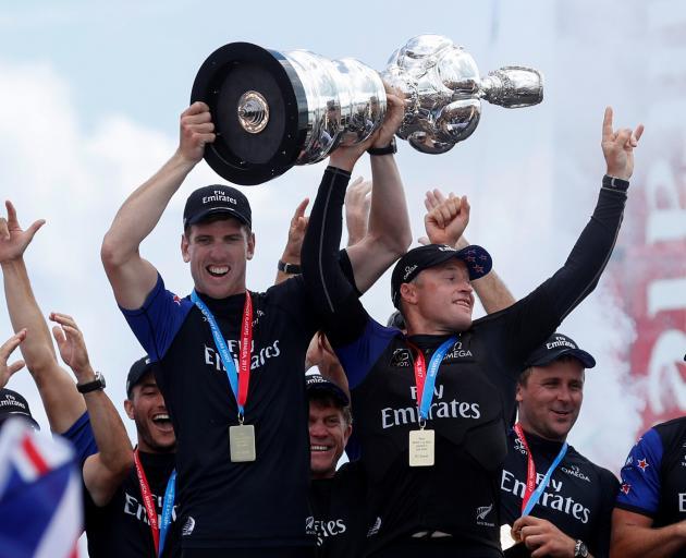 Peter Burling lifts the America's Cup after Team New Zealand's win in Bermuda. Photo: ACEA 2017