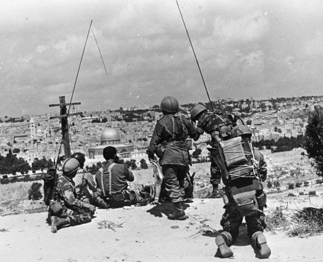 Israeli commander Motta Gur and his brigade observe the compound known to Muslims as Noble Sanctuary and to Jews as Temple Mount, from their command post on the Mount of Olives just prior to their attack of Jerusalem’s Old City, during the 1967 Middle Eas