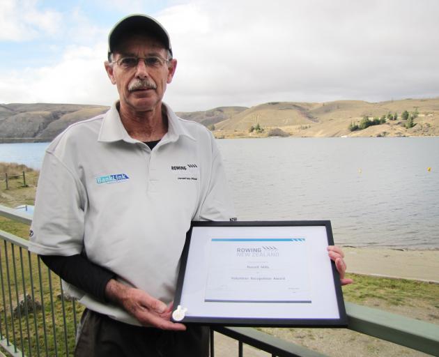 Dunstan Arm Rowing Club life member Russell Mills, of Alexandra, displays the certificate and badge he received for his New Zealand Rowing Award for 57 years' service to Central Otago rowing. Photo: Pam Jones