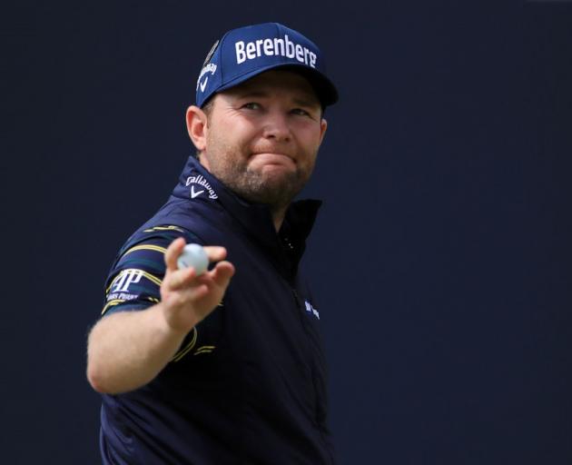 Branden Grace acknowledges the crowd during his record round at the British Open. Photo: Getty...