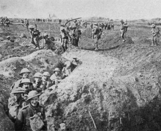 British support troops filing through a trench on the way to join an attack on the Western battlefield. - Otago Witness, 18.7.1917. 