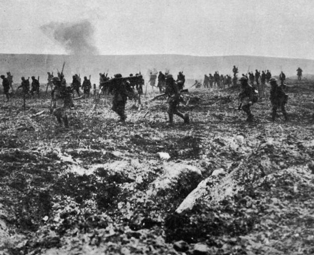 Canadian troops advancing over ``no man's land'' through German barbed wire and under heavy fire to the capture of Vimy Ridge. - Otago Witness, 25.7.1917. 
