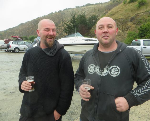 The crew of Vindicated, (left) Billy McEwan, of Ashburton, and Shane McCabe, of Dunedin, discuss their decision to pull out during a 100km race off Oamaru. Photo: Shannon Gillies