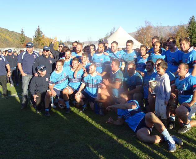 Wakatipu players pose for a team photo after claiming the coveted White Horse Cup by beating...