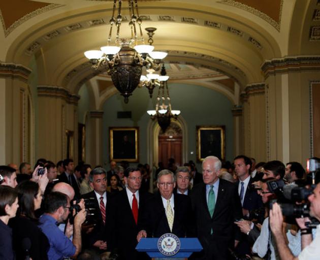 Senate Majority Leader Mitch McConnell, flanked by Senate Republican Leaders, speaks with reporters about healthcare legislation. Photo: Reuters