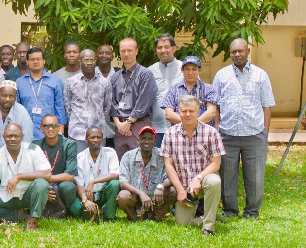 Professor Philip Hill (front, right, kneeling) at the Medical Research Council unit in Basse, Gambia. PHOTO: SUPPLIED