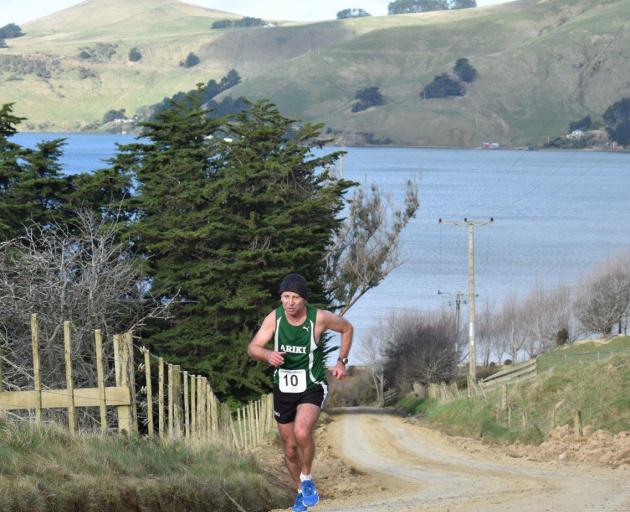 Brent Halley strides up Weir Rd from Papanui Inlet on the final leg of the Peninsula Relay on Saturday. Photo: Wayne Parsons