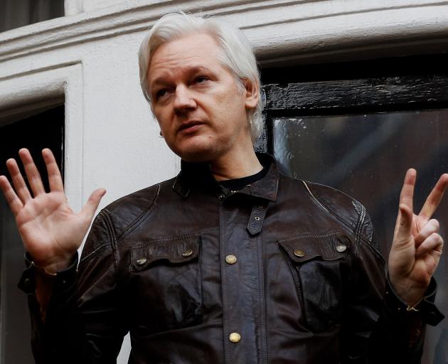 WikiLeaks founder Julian Assange addresses media from the balcony of the Ecuadorian Embassy in...