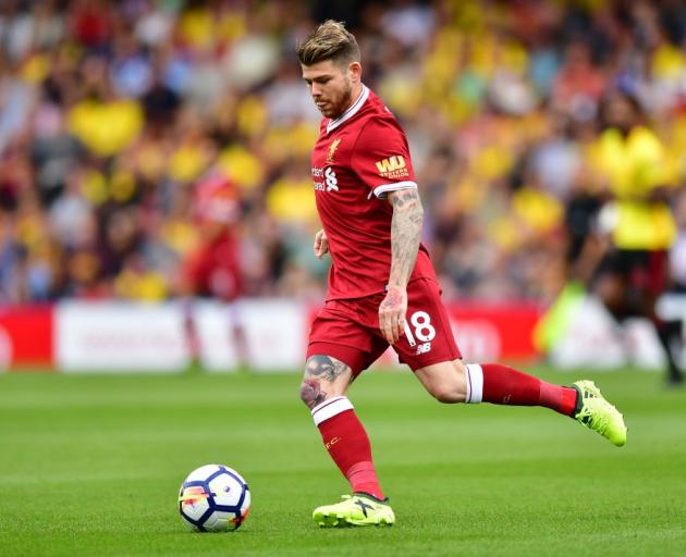 Liverpool's Alberto Moreno looks to play the ball during its season-opener against Watford. Photo...