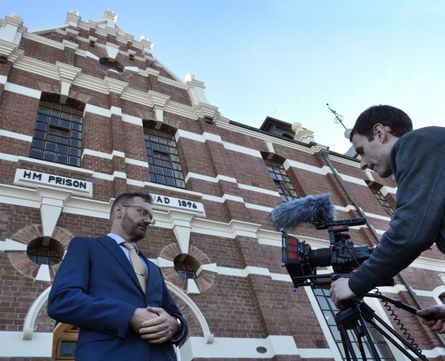 Abacus Multimedia producer Paul Dobson (left), of Sydney, is filmed by freelance cinemtographer Luke Bremner, of Dunedin, outside the old Dunedin Prison in Dunedin. Photo: Gerard O'Brien