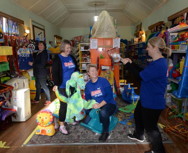 Swinging into action at the Caversham Toy Library yesterday are (from left) library secretary Mel Linwood and BNZ staff volunteers Kerry Lockhart, Jackie Hawkes and Kim Ingram. Photo: Linda Robertson