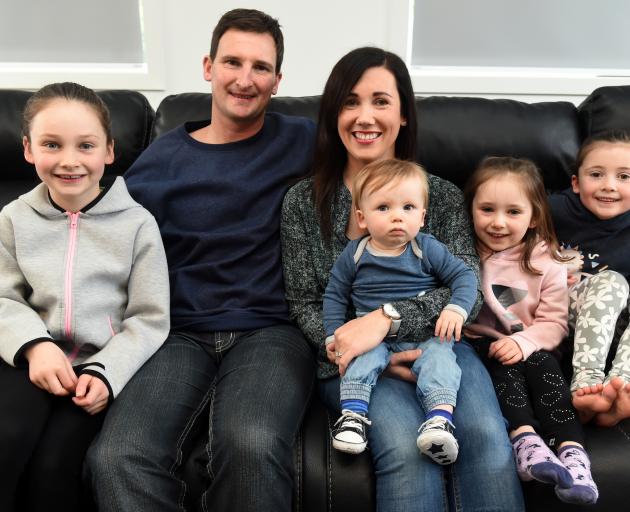 Maia (8), Bradley, Jennie, Charlie (10 months), Olivia (4) and Lucie (6) Scott at the family home in Dunedin yesterday. Photo: Gregor Richardson