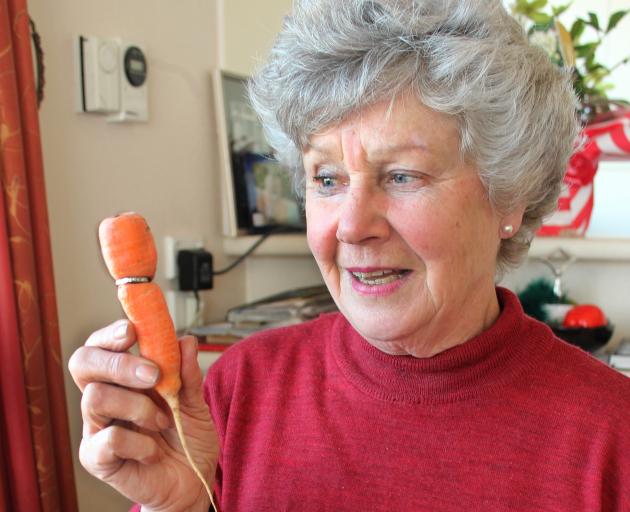 Carol Creighton was stunned when her friend found an  eternity ring embedded in a carrot in her vegetable garden, more than 10 years after she had lost it. Photo: Samuel White