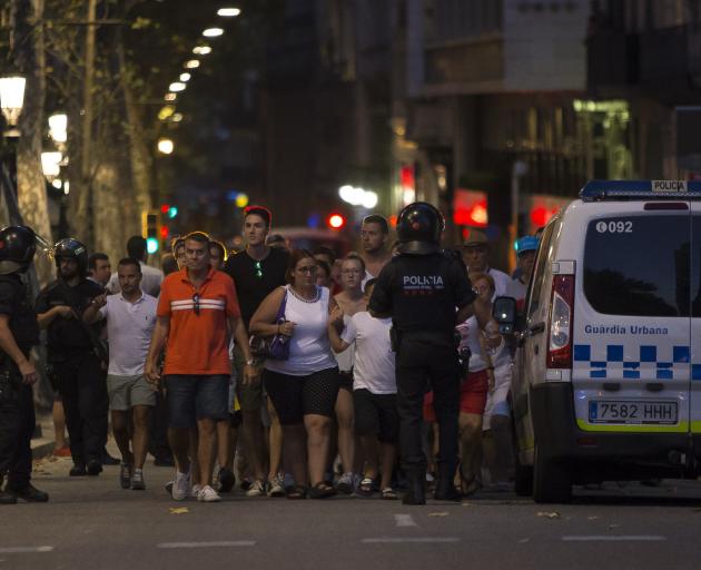 Police evacuate people from a shop at the popular tourist avenue. Photo: Getty Images 
