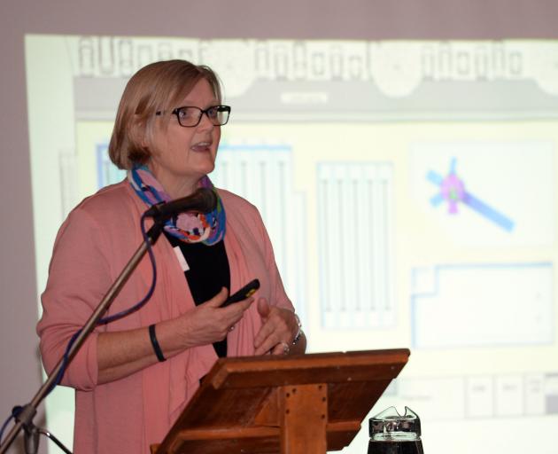 Taieri Communities Facility Trust chairwoman Irene Mosley, speaking at Coronation Hall in Mosgiel last night, reveals a possible concept plan for a new aquatic facility in the town. Photo: Linda Robertson