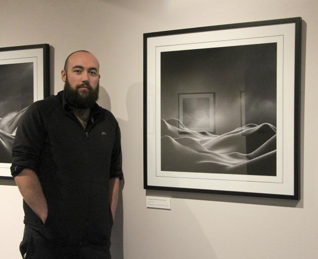 Invercargill photographer Cory Varcoe displays one of the artworks from his ``Bodyscapes'' exhibition at Central Stories Museum and Art Gallery in Alexandra. Photo: Southland Express