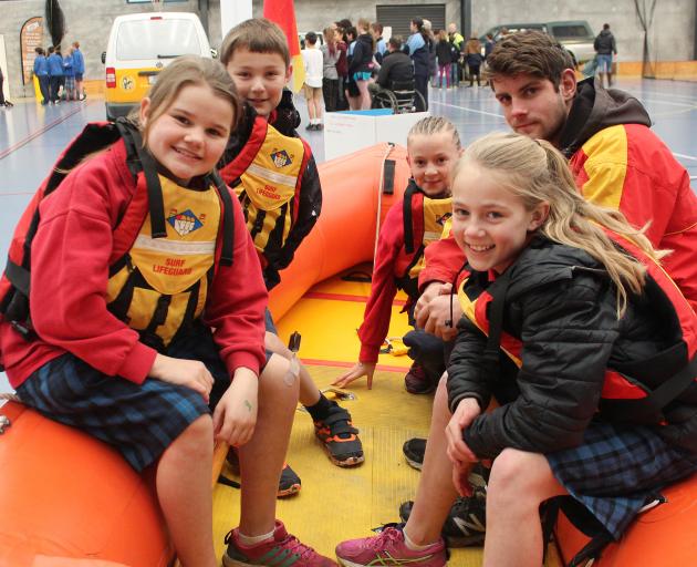 Rosebank Primary School pupils (from left) Greta Luke (11), Brayden Chaplin (11), Jessica Broderick (10) and Georgia Woodward (11, front) learn the ins and outs of surf safety with Duncan New at a \"Clued Up Kids'' safety learning day in Balclutha. Photo: 