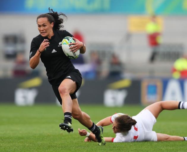 Portia Woodman on the way to scoring one of her four tries for the Black Ferns. Photo: Getty Images