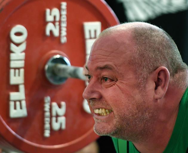 Central Districts powerlifter Ian Dennis lifts a squat of 250kg at the national powerlifting championships at the Dunedin Centre yesterday. Photo: Stephen Jaquiery