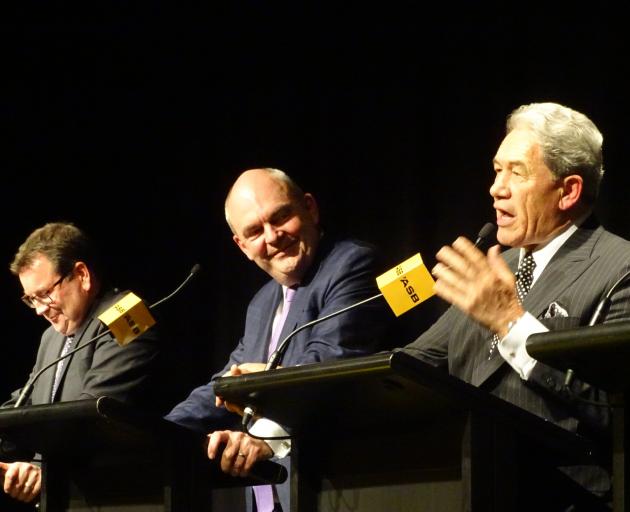 New Zealand First leader Winston Peters makes a point during a pre-election political debate in Queenstown last night as Labour finance spokesman Grant Robertson (left) and Finance Minister Steven Joyce listen. Photo: Guy Williams