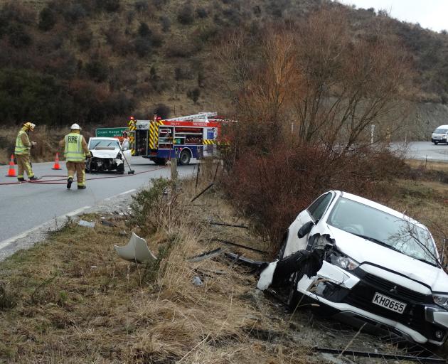 Emergency services attend  a head-on crash on  the Crown Range yesterday morning. Photo: Louise...