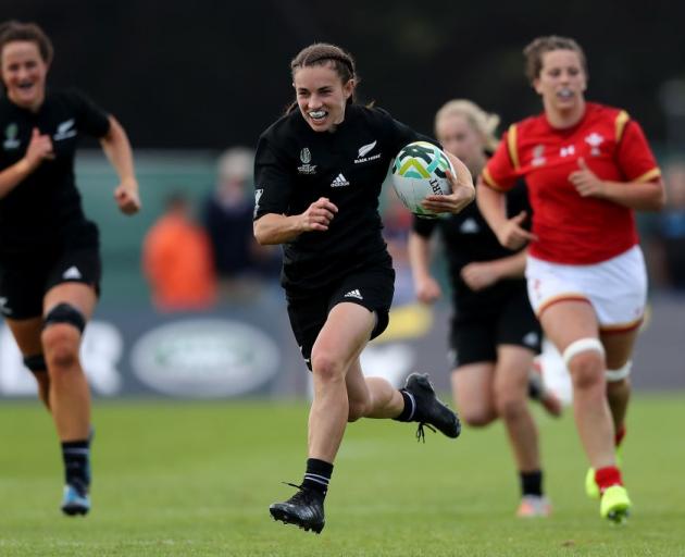 Selica Winiata on her way to scoring one of her three tries against Wales. Photo: Getty Images