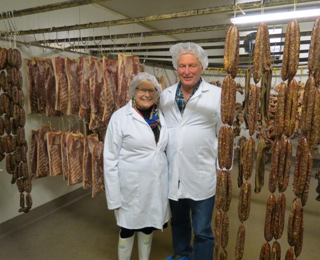 Linda McCallum Jackson and Ian Jackson in the meat-drying room of the Dunedin factory. Their pork comes from their pig farm in Hunter, near Waimate, and is processed in their Kaikorai Valley factory. Photo: Joshua Riddiford
