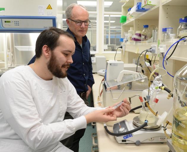 Dr Kiel Hards (foreground), watched by Prof Greg Cook, uses a chemostat in a laboratory at the University of Otago yesterday. Photo: Linda Robertson