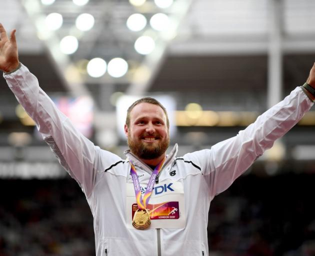 Tom Walsh on the medal podium. Photo: Getty Images