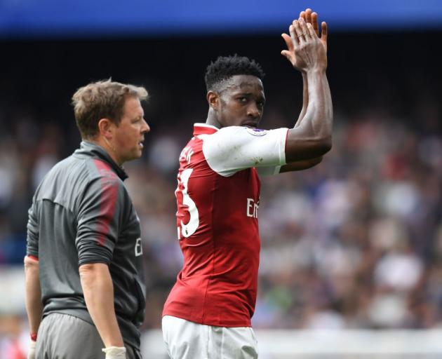 Danny Welbeck leaves the field with injury in Arsenal's game against Chelsea at the weekend....