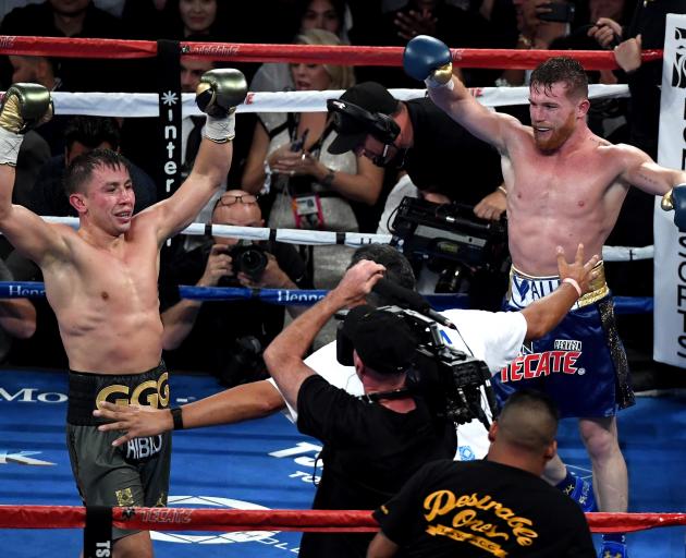 Gennady Golovkin and Canelo Alvarez both celebrate after the final round in their WBC, WBA and IBF middleweight championionship bout in Las Vegas. Photo:Getty Images