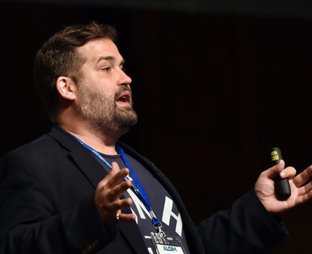 Justin Herman speaks to an audience at the Association of Local Government Information Management...