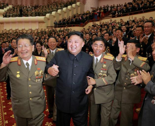 North Korean leader Kim Jong Un reacts during a celebration for nuclear scientists and engineers who contributed to a hydrogen bomb test. Photo: Reuters
