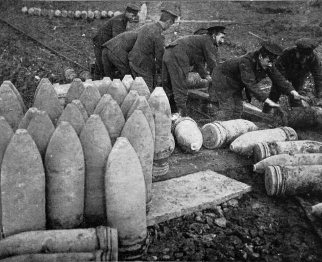 A never-ending supply of ammunition: loading shells on a trolley, to be taken to the guns at the...