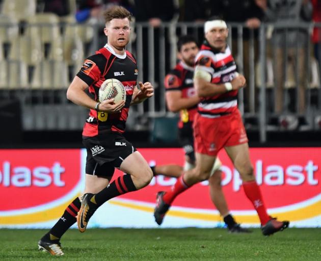 Canterbury halfback Mitchell Drummond on the way to scoring one of his four first half tries...