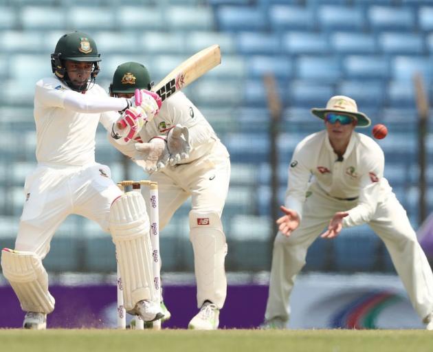 Mushfiqur Rahim plays the ball through the leg side for Bangladesh on the opening day of the...