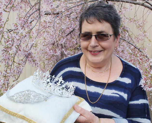 Alexandra Blossom Festival princess convener Dianne Elliot displays the range of royal headgear...