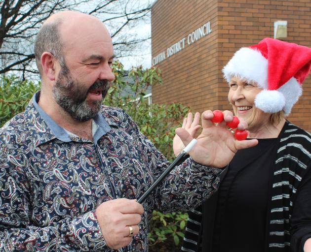 Clutha District Council waste minimisation officer Steve Clarke casts a spell on community development adviser Jean Proctor after the council approved funding for workshops where children can learn circus skills for the 2017 Santa Parade. Photo: Samuel Wh