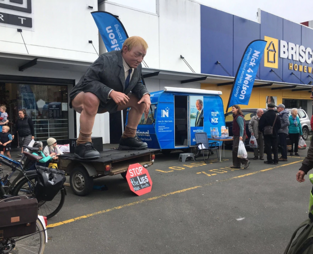 Nick Smith reportedly remained in his campaign caravan after the enormous horse manure sculpture was parked next to it in Nelson today. Photo: Supplied
