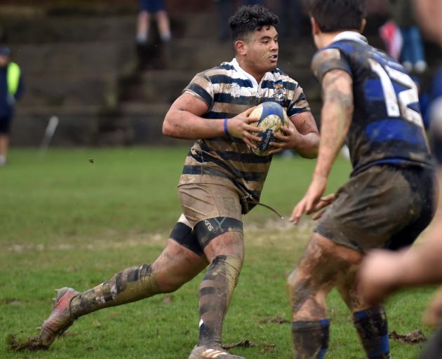 Otago Boys' High School first XV hooker Abraham Pole runs with the ball against Christchurch Boys...