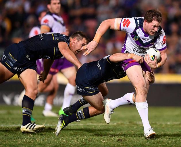 Timothy Glasby of the Storm makes a break during the match between the North Queensland Cowboys and the Melbourne Storm last month. Photo: Getty Images