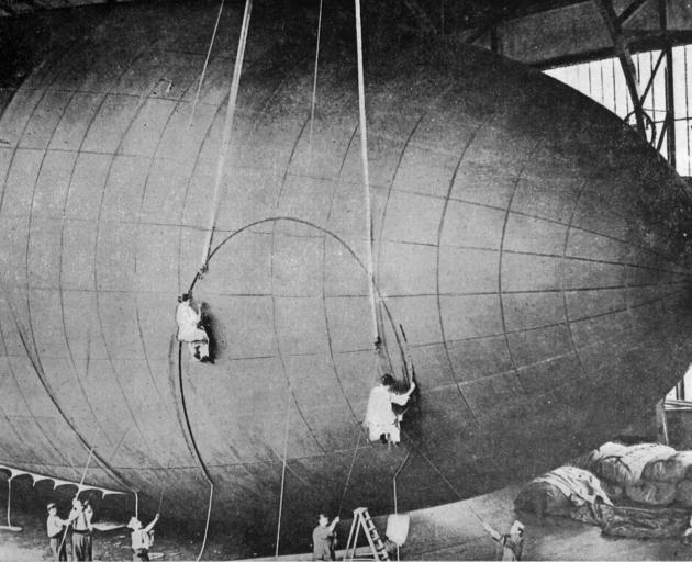 French women workers engaged in finishing work on an observation balloon in a factory in France. ...