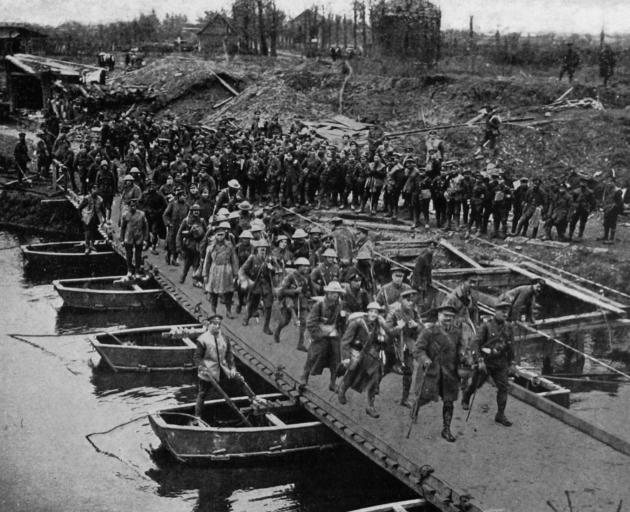 British troops crossing a pontoon bridge on the Western Front. - Otago Witness, 7.11.1917.