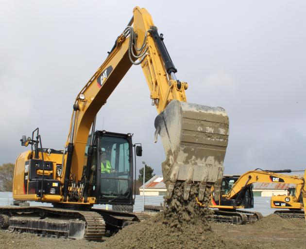 One of the first participants tries out a 15-tonne digger at Dig This Invercargill on the opening...