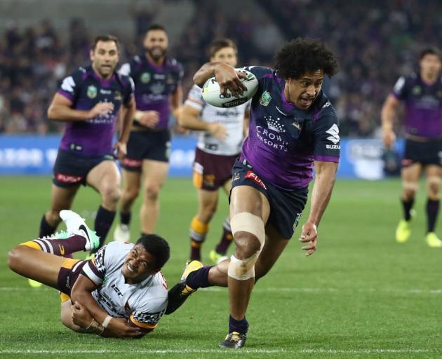 The Melbourne Storm's Felipe Kaufusi on the way to scoring against the Brisbane Broncos in the...