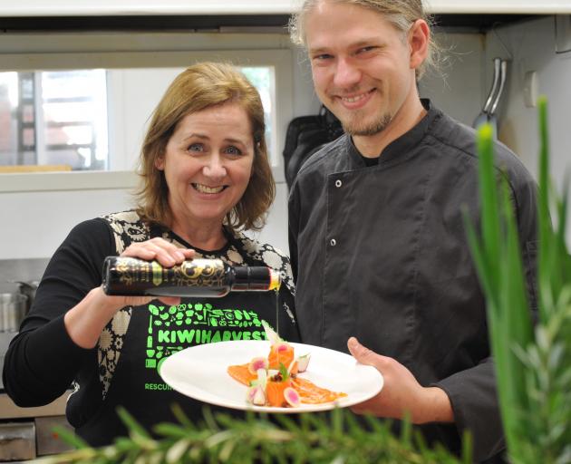 KiwiHarvest chief executive Deborah Manning puts the finishing touches to a meal prepared by...