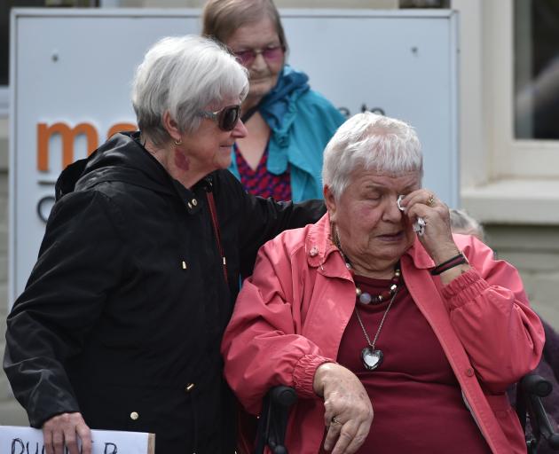 Margaret Matthews (76, left) comforts Nancye Coombes (88) at the protest. Photos: Gregor Richardson