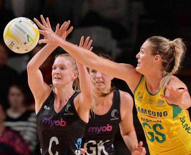 Australia's Caitlin Bassett intercepts a pass from the Silver Ferns' Shannon Francois during last...